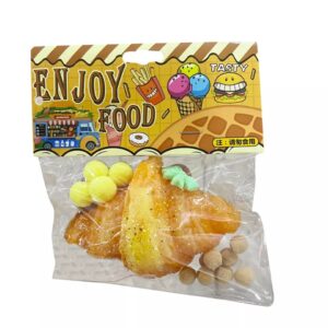 Jucarie Antistres Squishy, Flippy, cu Revenire Lenta, Squeeze Pinch Family, Model Croissant, 10x8 cm, 90g, Ambalaj Transparent, Maro